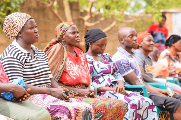 African gathering outdoors smile